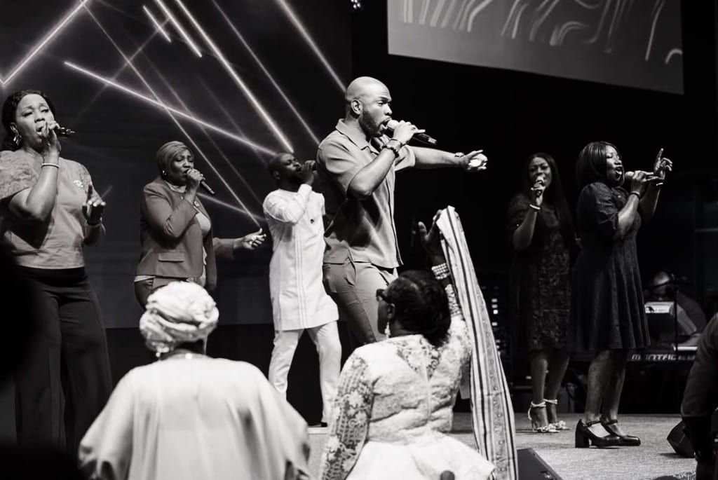 The Royalhouse Chapel worship team singing on stage as the congregation worships